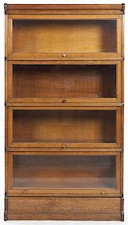 An American Oak Barrister Bookcase, Height 61 1/2 x width 34 x depth 10 1/2 inches.