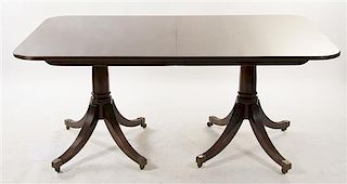 A Georgian Style Mahogany Double Pedestal Dining Table, Height 28 3/4 x width 68 x depth 44 inches.