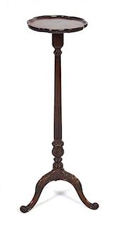 A Chippendale Style Mahogany Pedestal Table, Height 39 inches.