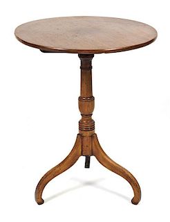 A Georgian Style Mahogany Occasional Table, Height 26 3/4 x diameter 14 7/8 inches.