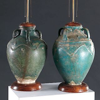 Associated pair ancient Islamic stoneware lamps