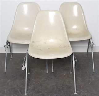 A Group of Six Charles and Ray Eames Chairs, Height 31 inches.