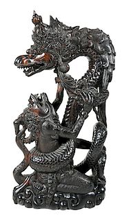 Carved Wood Mythical Figures in Battle