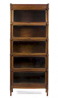 An American Oak Barrister Bookcase, Height 84 1/2 x width 35 3/8 x depth 12 1/2 inches.