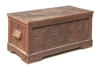 An Anglo-Indian Carved Wood Chest, Height 19 x width 39 1/2 x depth 20 inches.