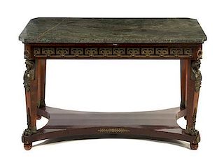 An Empire Style Gilt Metal Mounted Mahogany Center Table, Height 33 1/8 x width 54 1/8 x depth 29 7/8 inches.