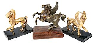 Three Bronze Mythical Animal Figures On Bases