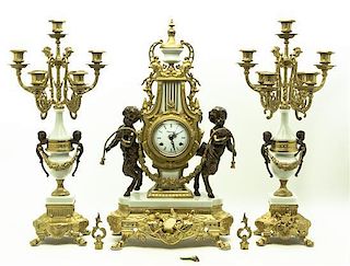 An Italian Gilt Metal Mounted Clock Garniture, Height of clock 24 1/2 inches.