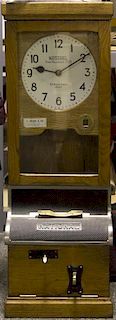 National Time Recorder Co., Ltd., Punch clock with Punch cards Height 38 1/2 x width 13 x depth 11 inches.