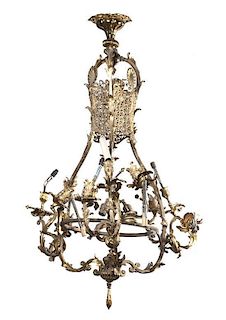 A Louis XV Style Gilt Bronze Twelve-Light Chandelier, Height 61 x diameter 21 inches.