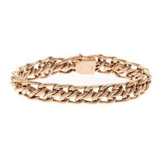 A Ladies Wide Gold Woven Bracelet