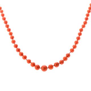 A Ladies Long Coral Beaded Necklace