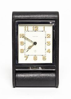 A Travel Clock, Cartier, Height of case 4 x width 2 1/2 inches.