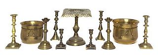 Four Pairs of Brass Candlesticks, Height of tallest 8 7/8 inches.