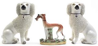 A Pair of Staffordshire Poodles, Height of each 8 1/4 inches.