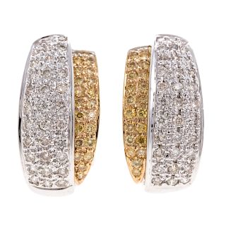 A Ladies Pair of Diamond Earrings in 14K