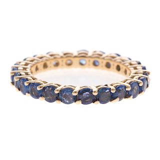 A Ladies Sapphire Eternity Band in 14K Gold