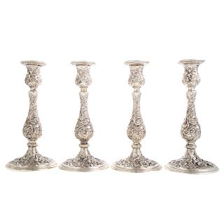 4 matching Kirk repousse sterling candlesticks