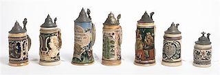 A Collection of Seven German Steins, Height of tallest 10 1/2 inches.