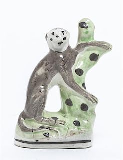 A Staffordshire Pottery Figure of a Monkey, Height 5 3/8 inches.