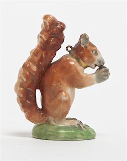A Staffordshire Pottery Red Squirrel, Height 2 5/8 inches.