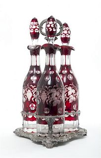 A Bohemian Glass and Silver-Plate Decanter Set, Height over handle 15 1/2 inches.
