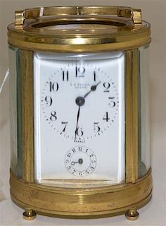 A French Brass Carriage Clock, Height 4 1/2 inches.