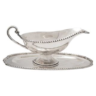 A STERLING SILVER SAUCE BOAT AND TRAY 