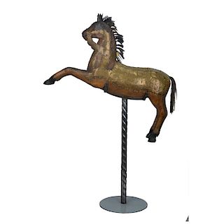 A POLYCHROME WOOD CAROUSEL HORSE WITH METAL APPLIQUES. 