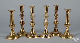 Three pairs of brass push-up candlesticks