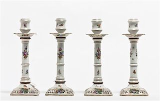 A Set of Four Dresden Porcelain Candlesticks, Height 9 3/8 inches.