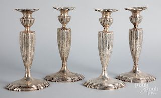 Set of four Durgin weighted silver candlesticks