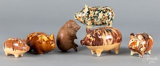 Six pottery and porcelain pig banks.
