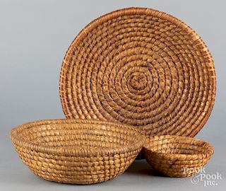 Three shallow rye straw baskets