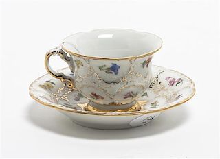 A Meissen Porcelain Teacup and Saucer, Height of teacup 2 1/8 inches.