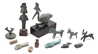 A Group of Eight Bronze Antiquities, Height of tallest 3 inches.