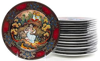 Twenty-Four Russian Transfer Decorated Porcelain Plates, Diameter 7 3/4 inches.