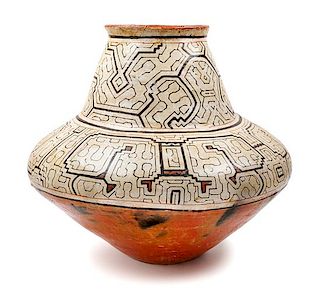 A Peruvian Pottery Jar Height 19 1/2 inches.
