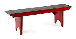 A Rustic Red-Painted Bench Height 18 3/4 x width 60 1/2 x depth 13 inches.