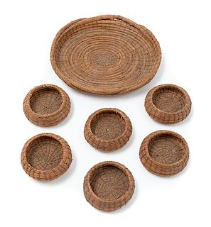 A Seven-Piece Woven Basket Set Width of largest 8 inches.