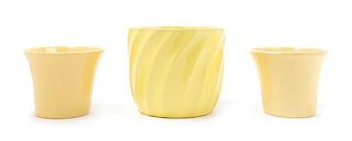 Four Yellow Glazed Molded Ceramic Vessels Height of tallest 6 1/2 inches.