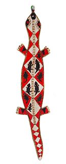 A Beaded and Cowrie Shell-Applied Salamander Length 52 inches.