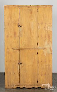 Painted pine one-piece corner cupboard, 19th c.