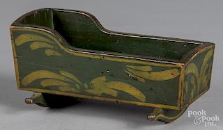 Painted pine doll cradle, late 19th c.