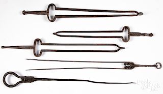 Four sets of iron fire tongs, etc.