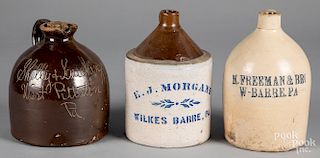 Three stoneware merchant jugs