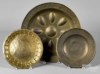 Three embossed brass plates/chargers, 19th c.
