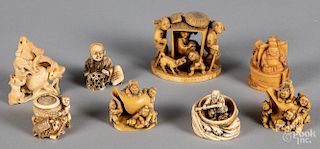 Eight Japanese Meiji period carved ivory netsuke.