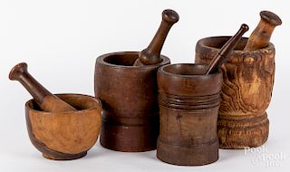 Four turned wood mortar and pestles, 19th c.