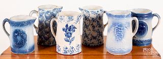 Six blue spongeware pitchers, 9 1/4" h.
